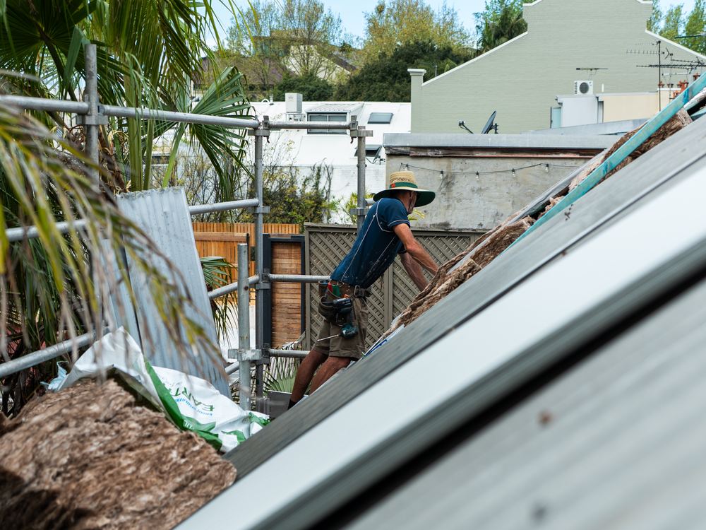 ADKO roofer working on a steep heritage roof