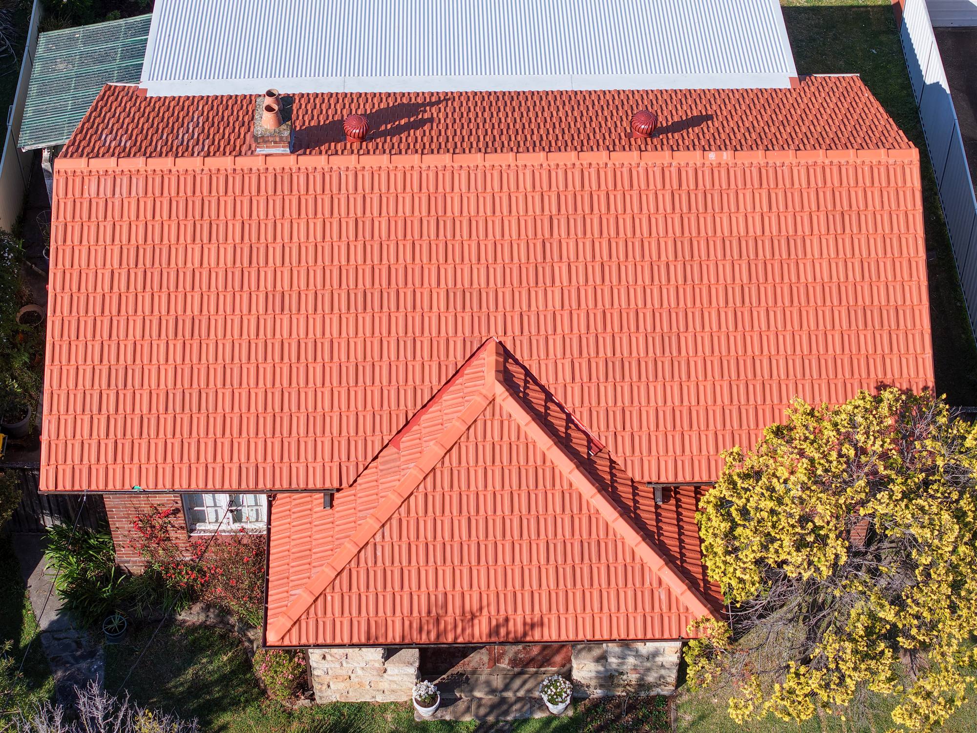 Freshly restored orange tile roof seen from above