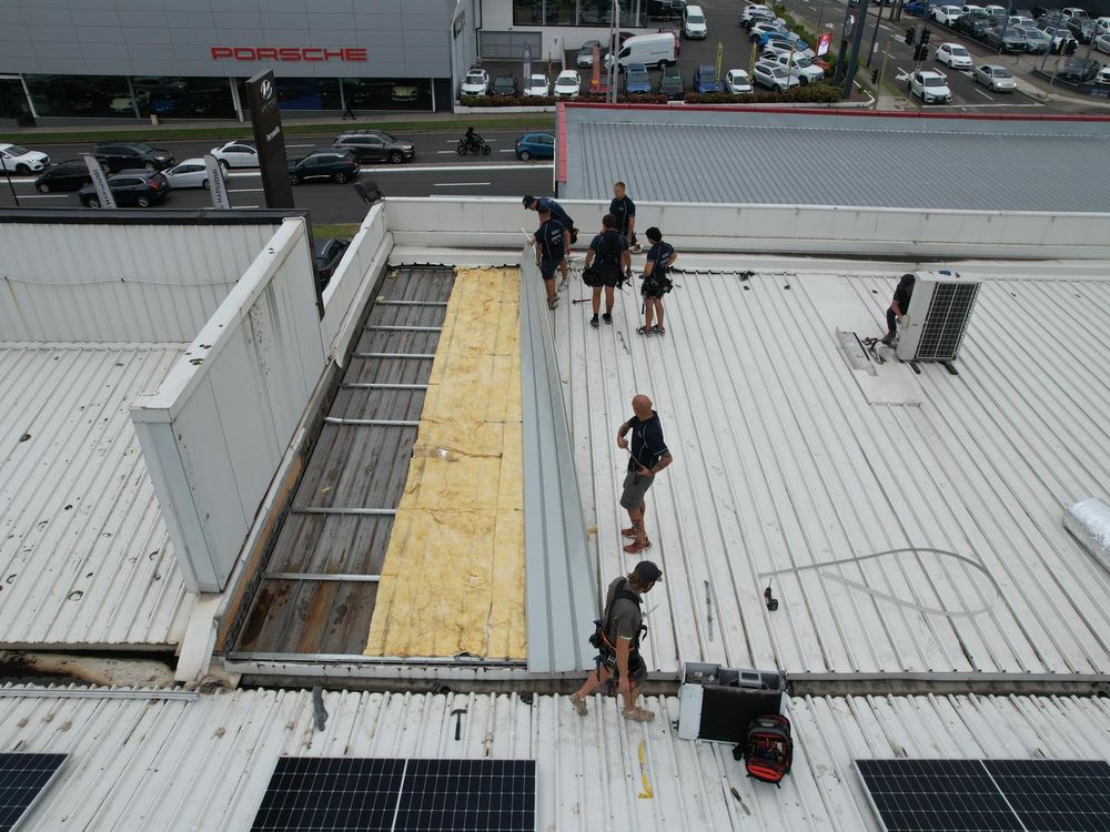 ADKO crew replacing a large commercial metal roof