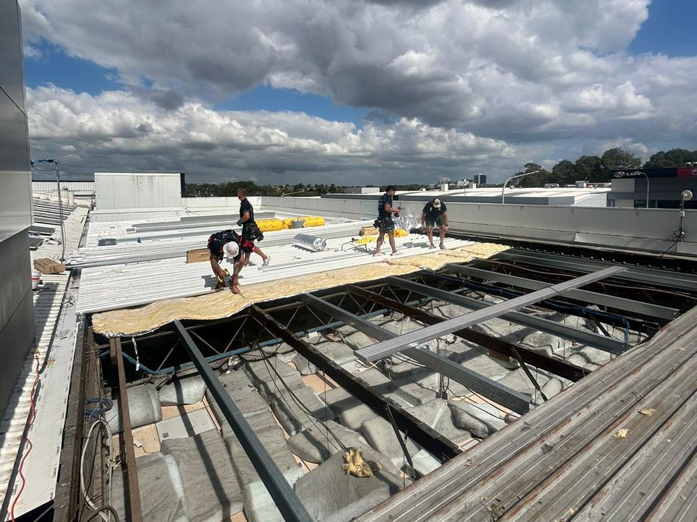 Commercial roof stripped back to the purlins during a re-roof