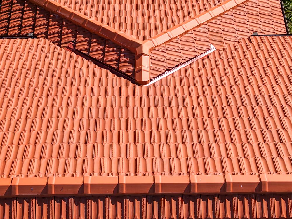 Freshly restored terracotta tile roof ridge in Sydney